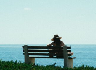 Why You Shouldn’t be Afraid to Travel Alone Woman sitting on bench