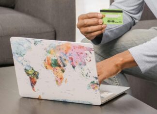 How to Pay For Your Vacation With Credit Card Points Man shopping online with his credit card