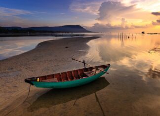 Want to Explore Asia? Start Here Boat on a beach