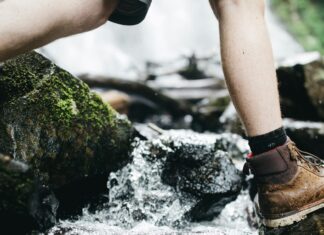 These Shoes Are Ideal For Your Next Active Vacation Hiking boots in a stream