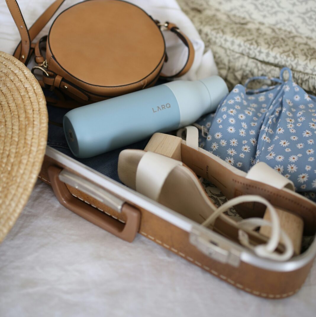 Summer travel essentials packed in a bag