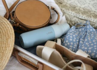 Emirates Flight Attendant Reveals Her Most Important Packing Tips Summer travel essentials packed in a bag