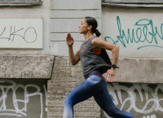 Essential Items to Take on Active Trips According to Frequent Travelers A Side View of a Woman Jogging on the Street