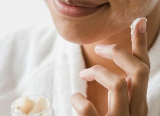 3 Skincare Products You Should Always Take With You Close-Up Photo of a Person Applying Facial Cream on Her Face