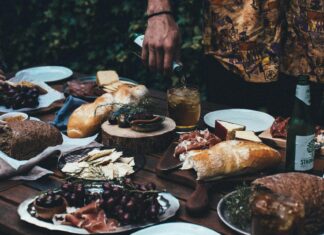 Locally-Owned Restaurants You Should Dine at in The United States Crop man pouring drink at a served table