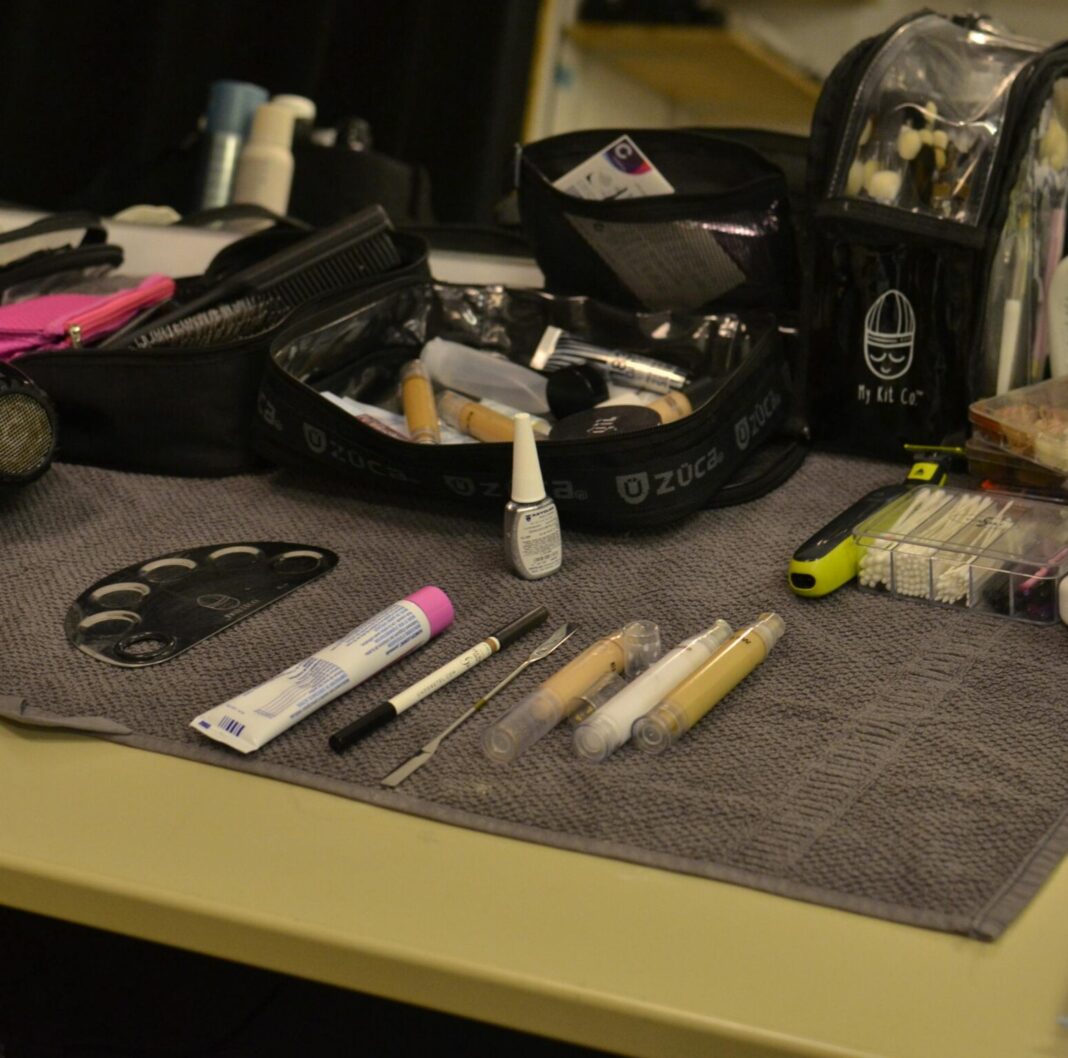 Makeup bag on a table with makeup products laid out