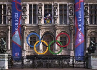 How Paris, France is Preparing for Olympic Tourist Season Olympic Logo for the 2024 Olympics in Paris, City Hall