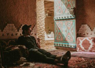 This Multi-Nation Visa Opens the Door to the Middle East Man lounging in a home in Riyadh, Saudi Arabia