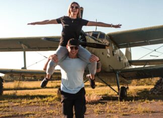 3 Friendliest Airports In The United States Man Carrying Woman Beside Airplane