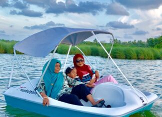 How to Prioritize Activities on a Short Vacation Woman riding a peddle boat in Dhadimagu Kilhi, Fuvahmulah, Maldives