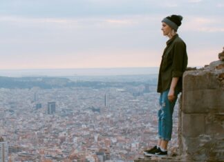 Safety Tips Solo Travelers Must Follow Girl standing on the Bunker in Barcelona