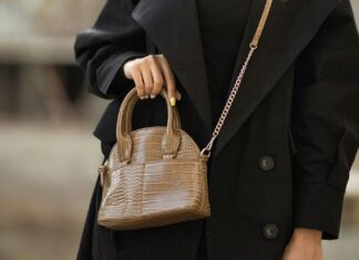 Best Purses for Travelling Woman holding brown purse