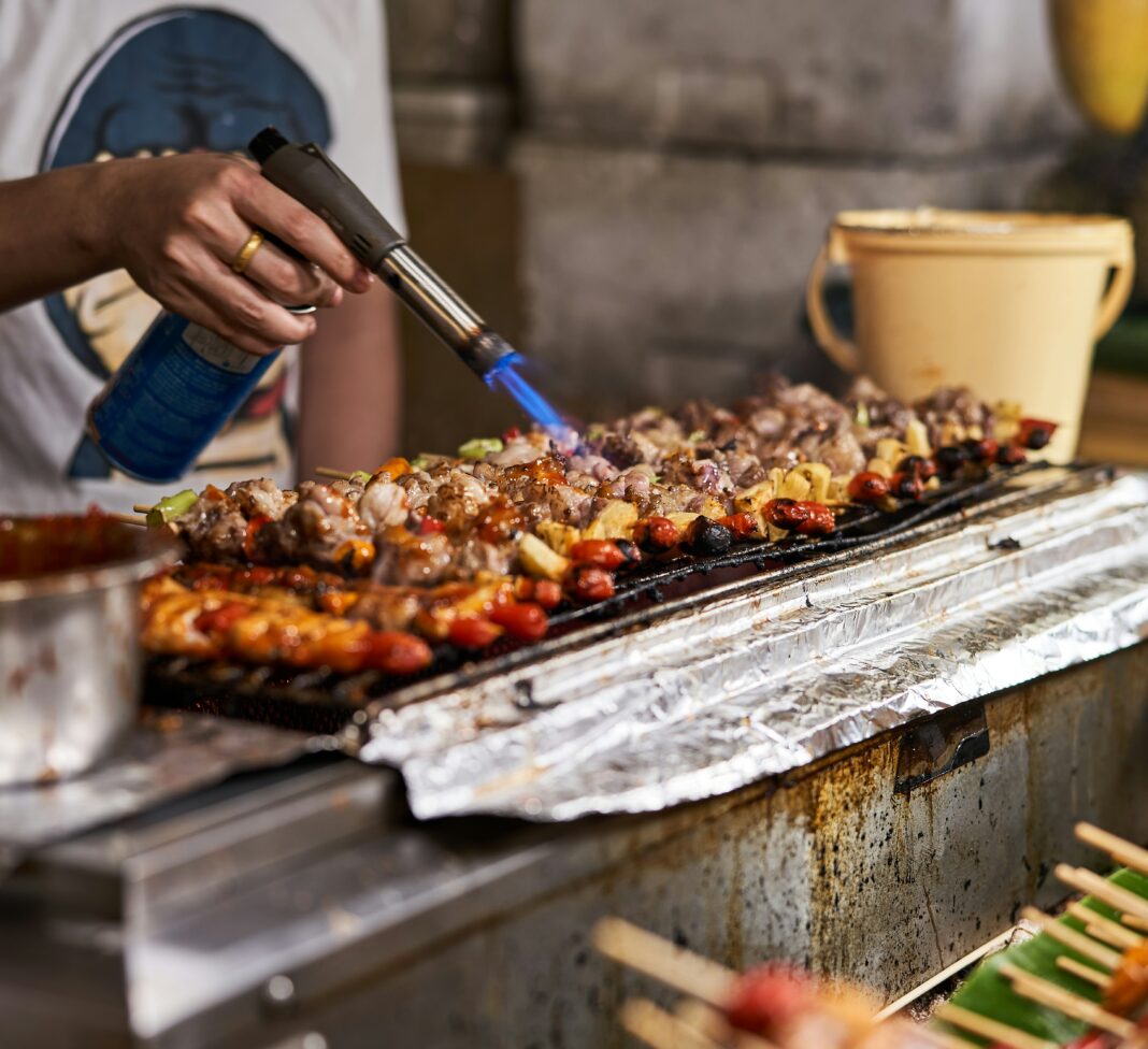 Street food barbecue at a night market in Bangkok