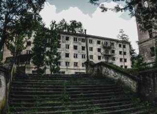3 Ghost Towns of Europe’s Former Glory Steps leading to an abandoned building
