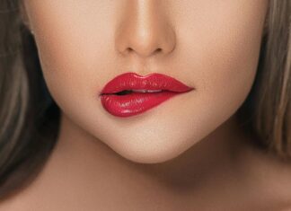 3 Lip Colors That Will Look Great On Vacation Close up Photo of Woman Biting Her Lower lip