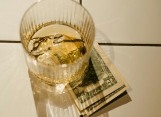 Here’s How Much You Should Be Tipping While Abroad Clear Drinking Glass With Ice Cubes and Ice Cubes