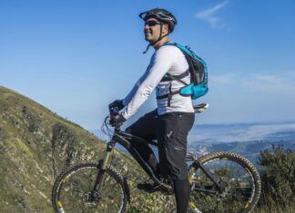 3 Essentials for Bike-Packing This Summer Man With White Shirt Riding a bicycle on a Mountain