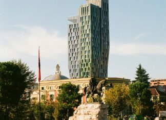 Have You Ever Been to Albania? Skanderbeg square with a view of the statue and modern architecture behind.