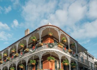 3 Reasons to Go to New Orleans Corner of a building with balconies