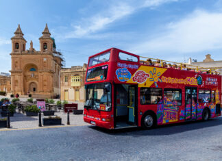 Pros & Cons of Hop-On Hop-Off Buses Worth Keeping in Mind Bus for tourists with routes to the interesting sights of the island of Malta